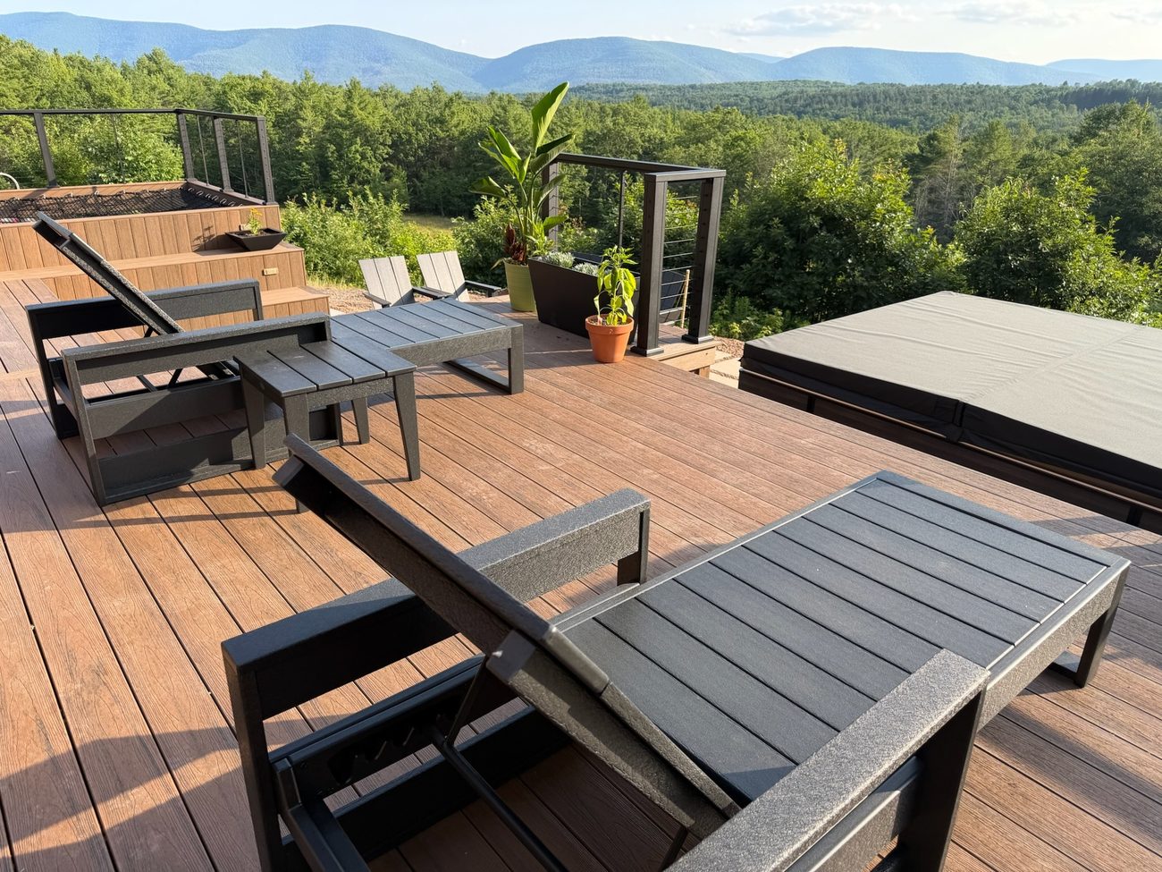 The deck with loungers and mountain view